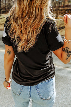 Black crew neck t-shirt with glitter ghost motif on shoulders