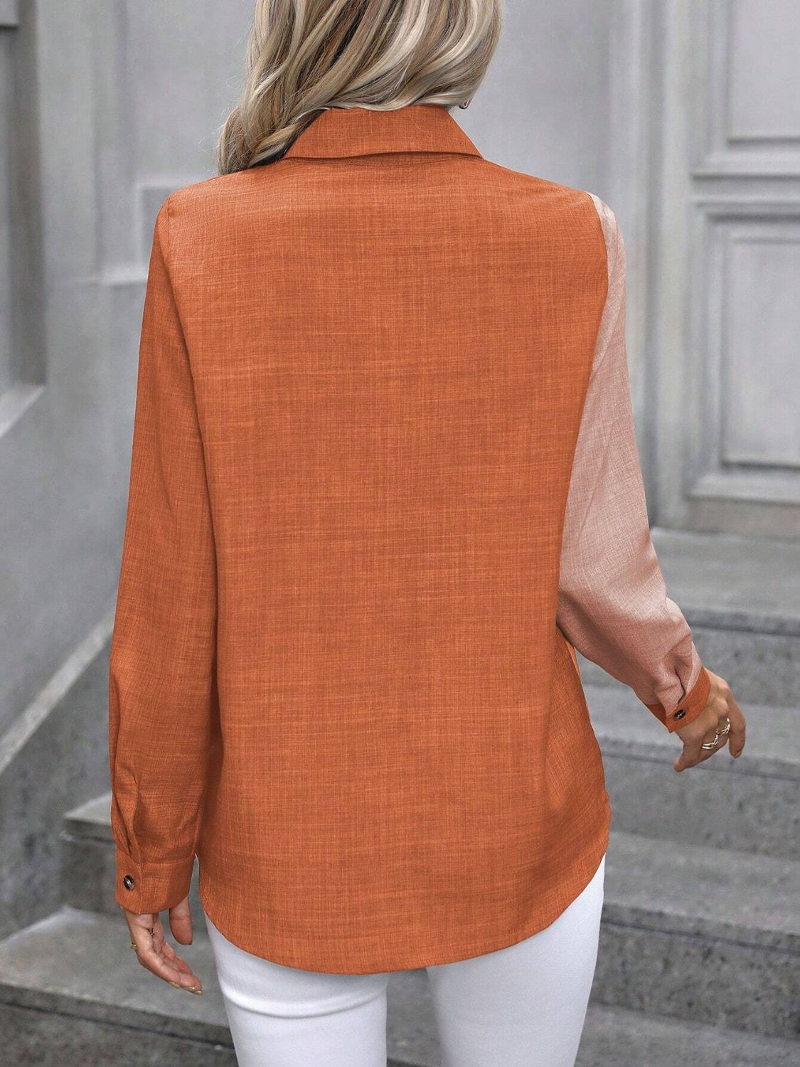 Two-tone orange and light pink denim button-down shirt with a textured weave.