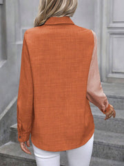 Two-tone orange and light pink denim button-down shirt with a textured weave.