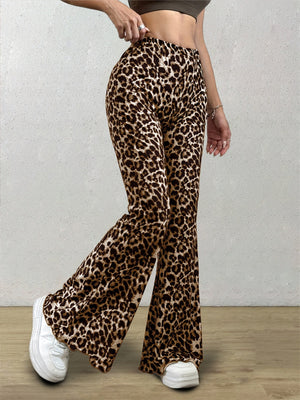 Leopard print bell bottom pants with a flared leg, styled with white sneakers.