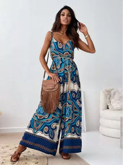 Peacock Blue paisley patterned tied wide-leg romper with V-neck and tie belt.