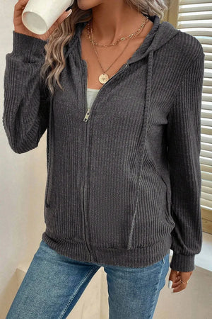 Dark gray textured ribbed knit zip-up hoodie with drawstring hood and pockets.