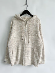 Speckled knit relaxed zip-up hoodie in a light neutral tone with a herringbone pattern.
