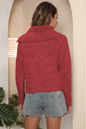 Deep Red textured knit sweater with asymmetric collar and long sleeves.