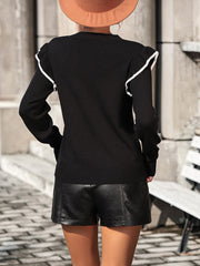 Black crew neck sweater with contrast trim ruffle shoulders