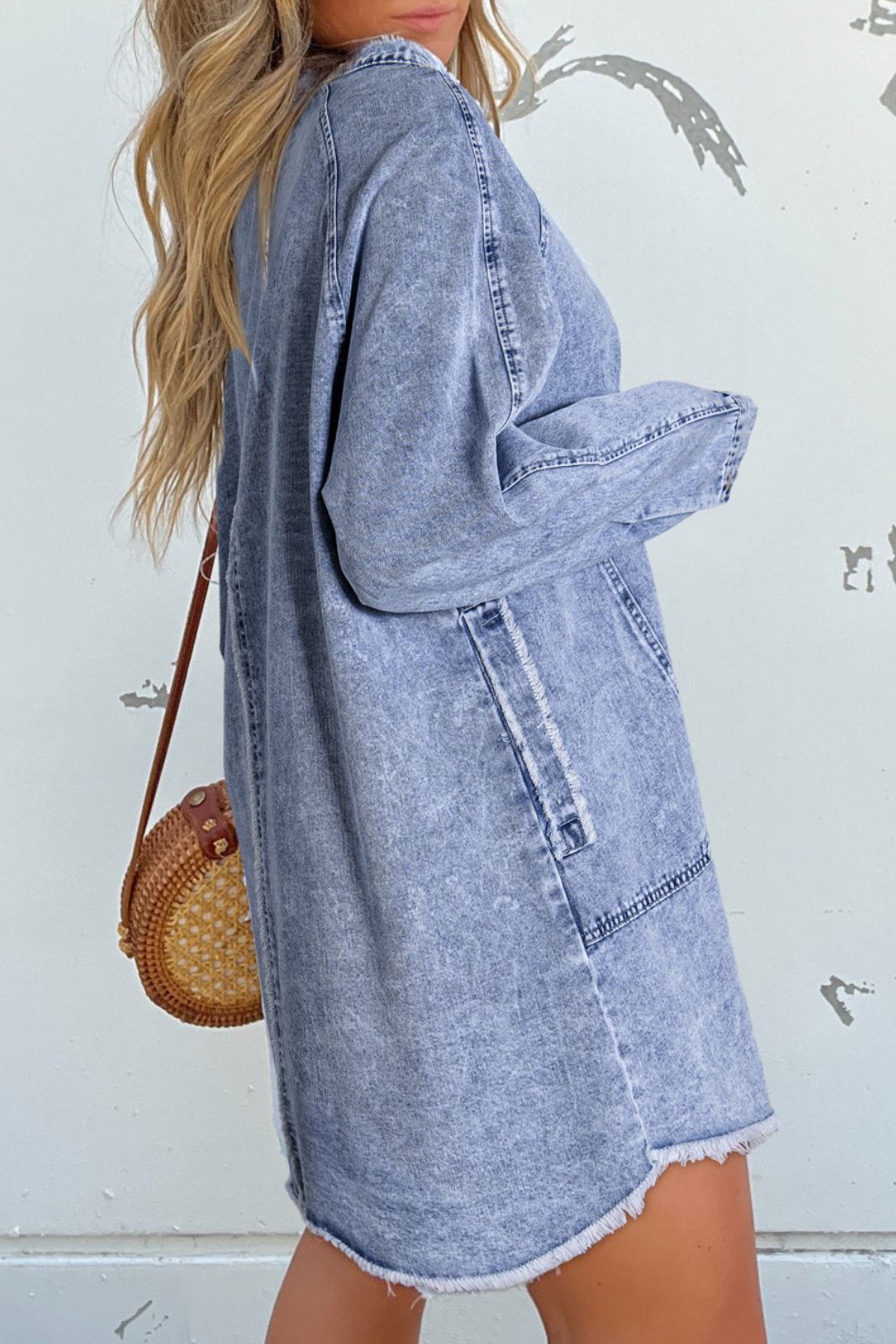 Acid wash denim shirtdress in medium with raw hem and button details.