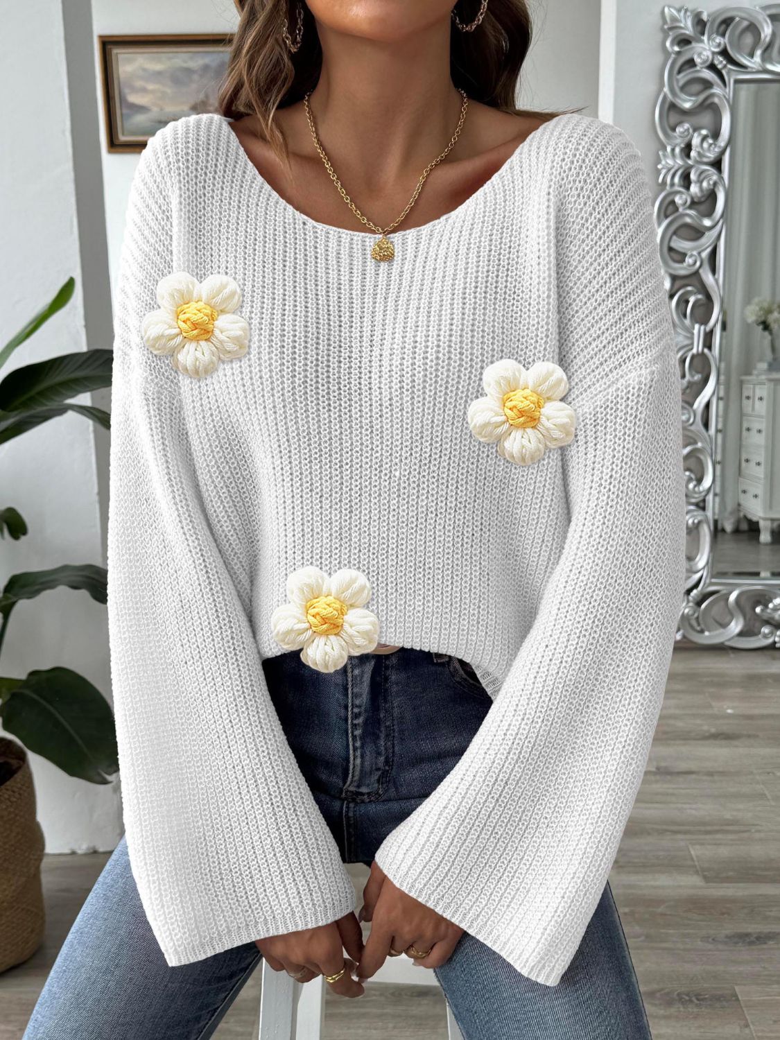 White knit sweater with floral appliqués and bell sleeves