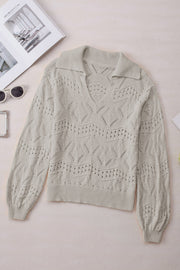 Gray openwork collar knit sweater with V-neck and long sleeves.