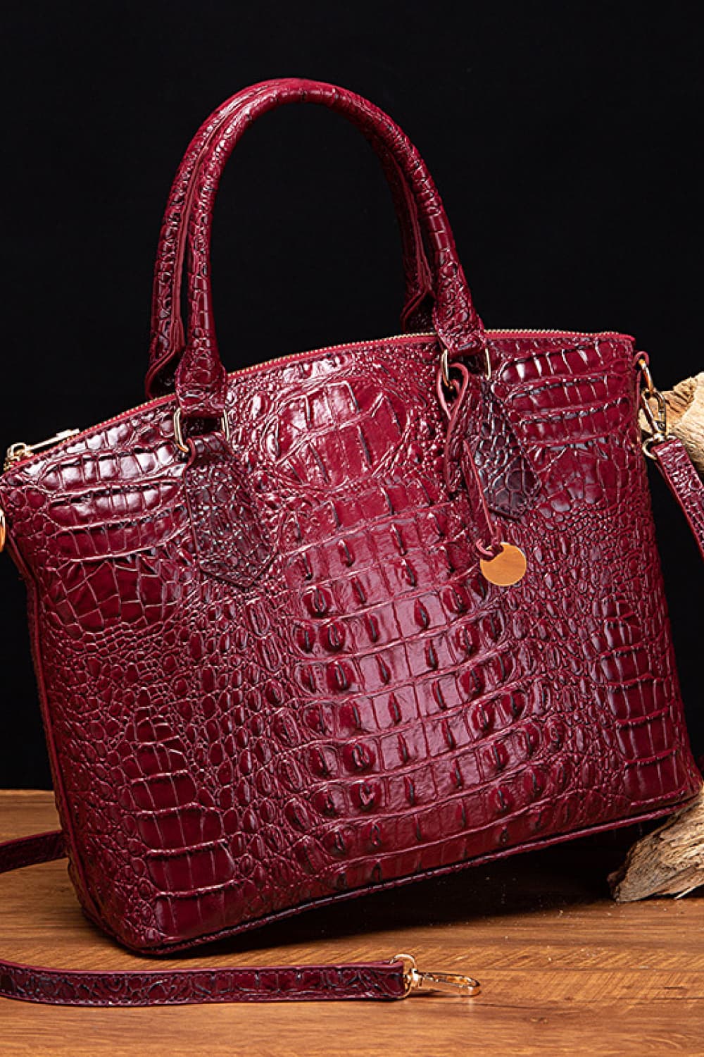 Deep Red crocodile embossed satchel bag with top handle and gold hardware detail.