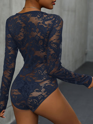 Dark blue lace bodysuit with long sleeves and intricate floral pattern.