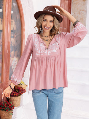 Blush pink embroidered yoke blouse with gathered bodice and tie neck