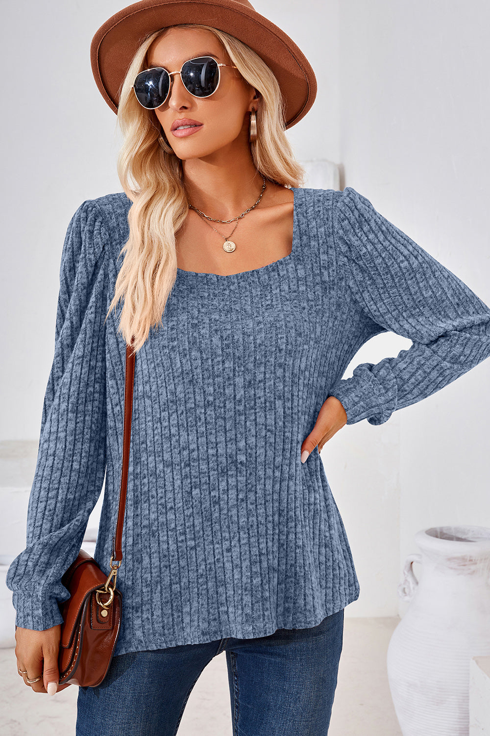 Dusty blue ribbed square neck top with puffed sleeves and a relaxed fit.