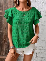 Green textured smocked blouse with ruffle sleeves and a scoop neckline.