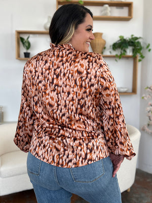 Caramel animal print blouse with ruffle neckline and balloon sleeves