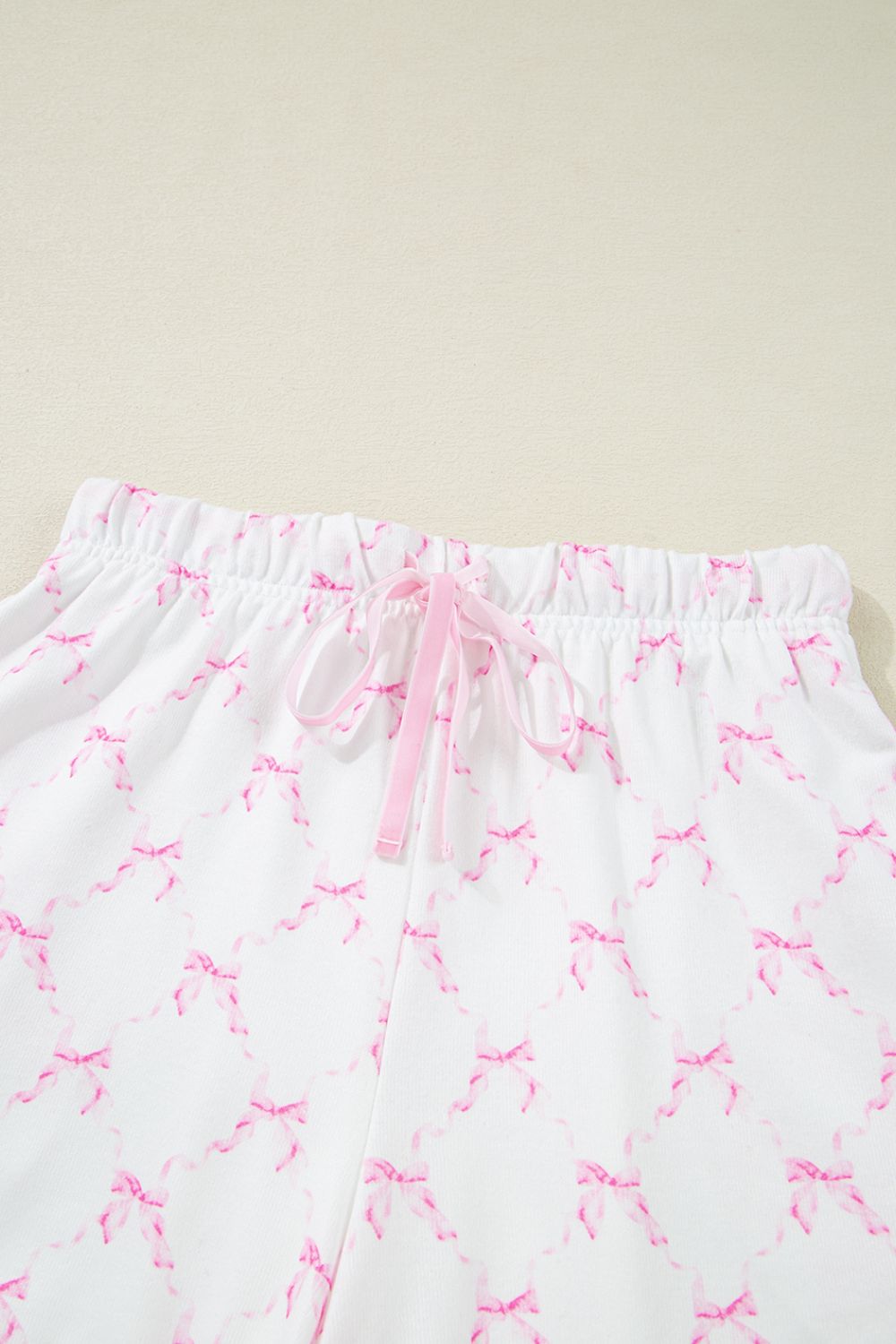 Pink bow print loungewear shorts with drawstring and elastic waist