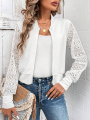 White bomber jacket with lace sleeves and zip front, styled with a white tank and jeans.
