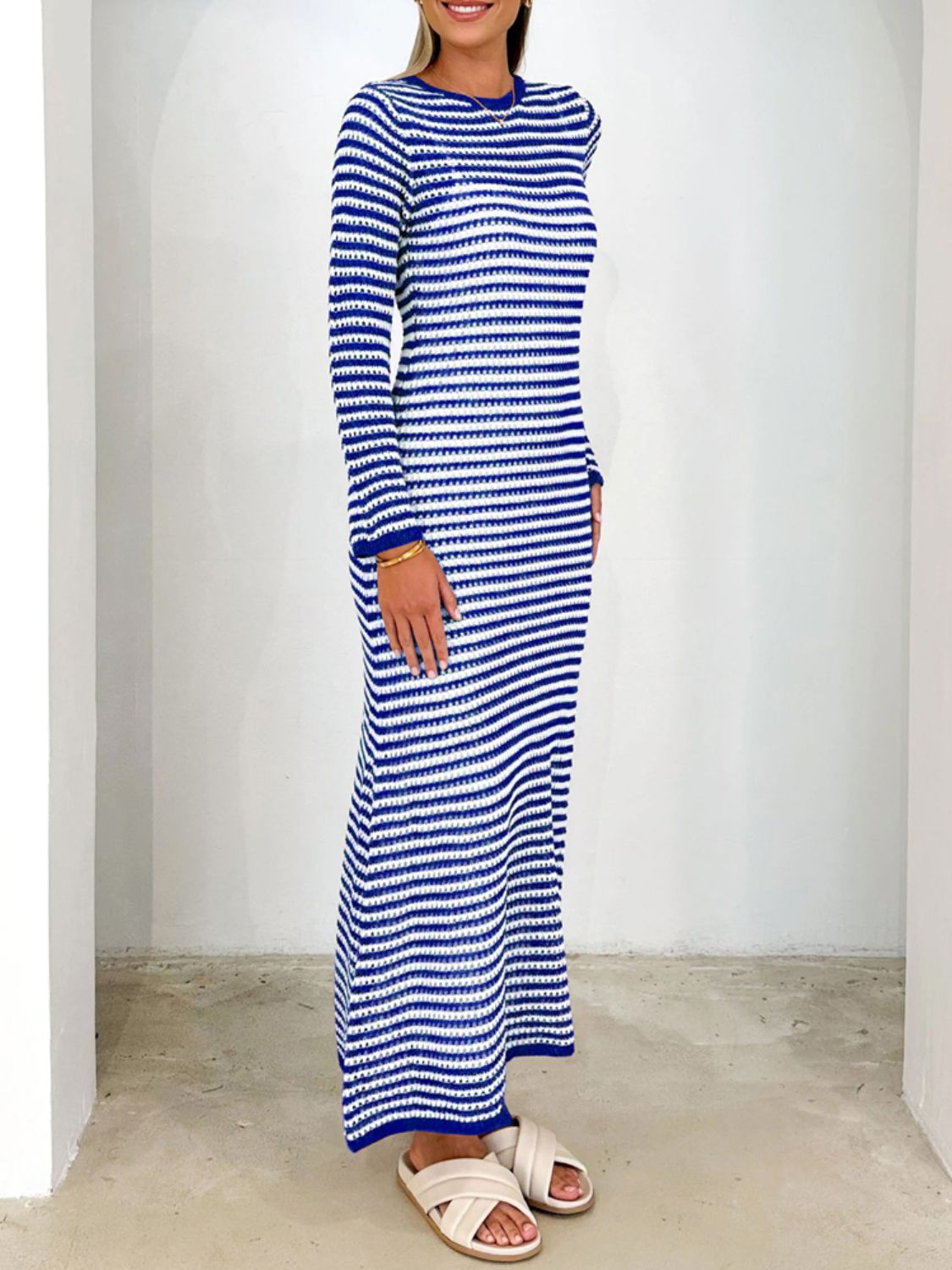 Blue and white striped maxi sweater dress with long sleeves and a crew neck.