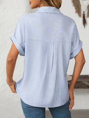 Light blue striped button-down shirt with cuffed short sleeves and a relaxed fit.