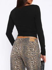 Black long sleeve ribbed crop top with a square neckline.