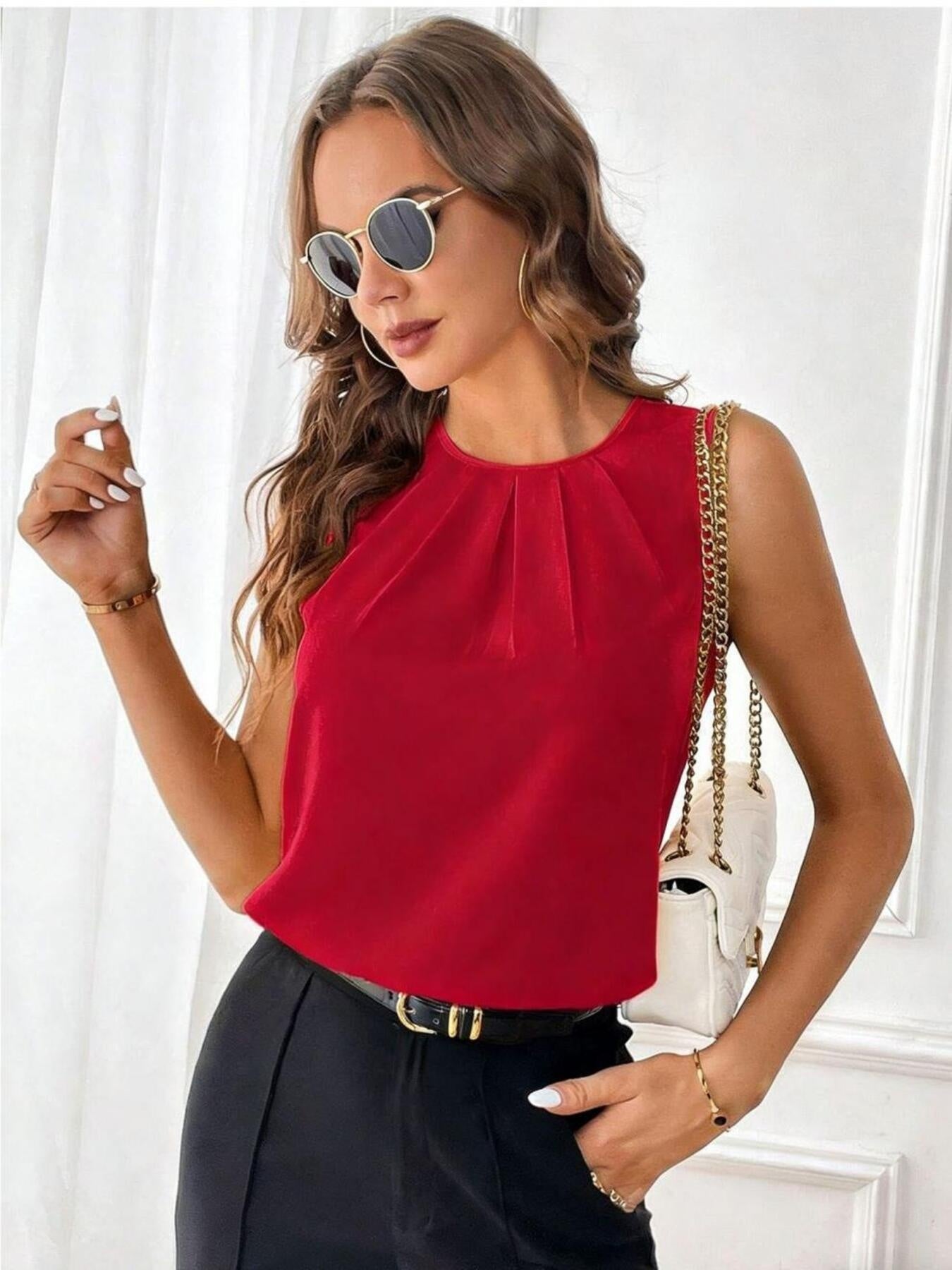 Red sleeveless tank top with pleated neckline detail