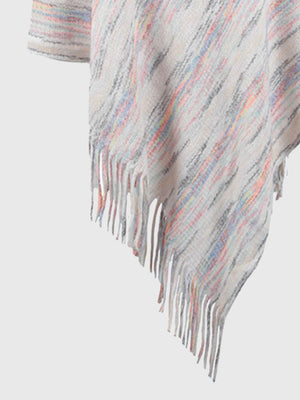 Hooded mélange cape in ivory with colorful yarn stripes and fringe detail