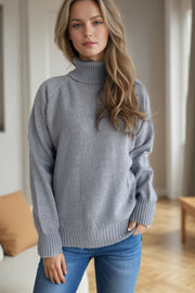 Gray speckled Donegal turtleneck sweater with ribbed cuffs and hem.