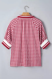 Red gingham cotton blend shirt with puff sleeves and striped collar and cuffs.