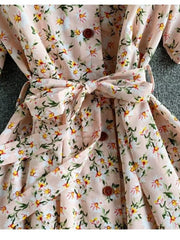 Apricot floral v-neck midi dress with belted waist and button details