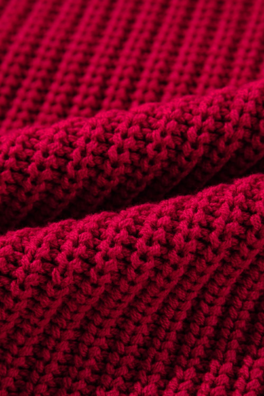 Deep red acrylic knit sweater with ribbed texture detail