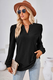 Black textured puff sleeve henley blouse with V-neck and long sleeves