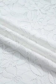 White sheer lace blouse with floral pattern and ruffled neckline detail