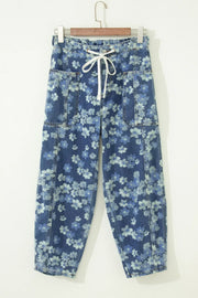 Floral drawstring barrel jeans with pockets in blue denim, featuring a cropped length and daisy pattern.