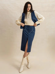 Peacock blue suede vest and button-front midi skirt set with contrast stitching.