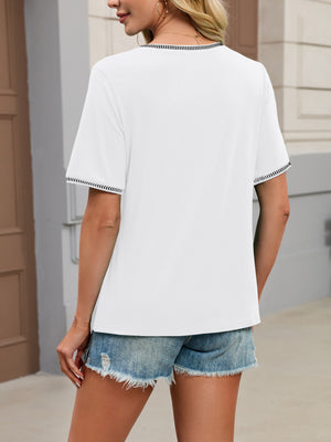 White short sleeve t-shirt with black contrast trim on neckline and sleeves