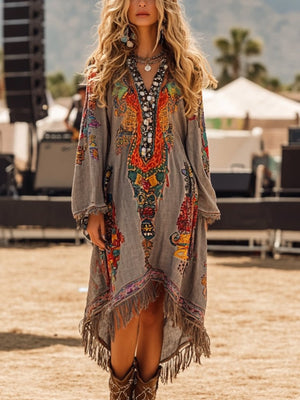 Bohemian gray long-sleeve dress with colorful print, beaded neckline, and fringe hem.