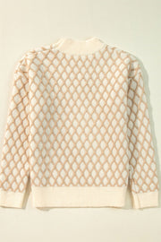 Diamond knit sweater in cream with balloon sleeves and a mock neck.