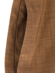 Brown wide leg jumpsuit with textured fabric and a side pocket detail.