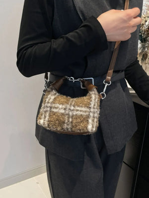 Shearling check mini shoulder bag with leather trim and strap.