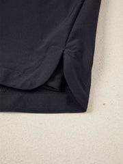 Black jogger shorts with side slits and a ribbed waistband detail.