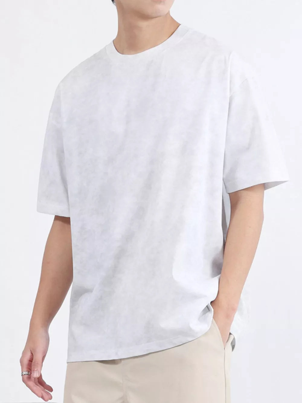 Men's relaxed fit t-shirt in white cotton blend with a subtle textured pattern.