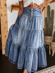 Tiered denim maxi skirt in medium wash with button front and ruffled hem.