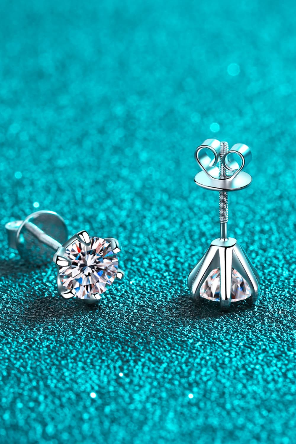 Silver six-prong solitaire stud earrings with clear cubic zirconia stones.