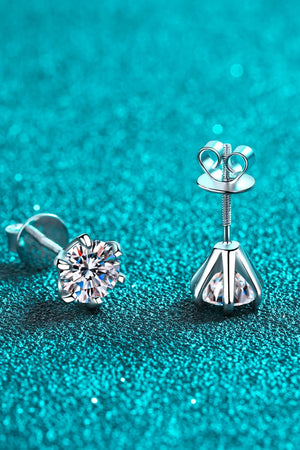 Silver six-prong solitaire stud earrings with clear cubic zirconia stones.