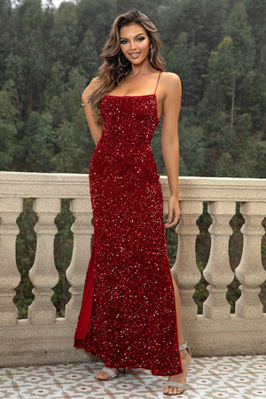 Crimson sequin cami gown with backless detail and thigh-high slit.