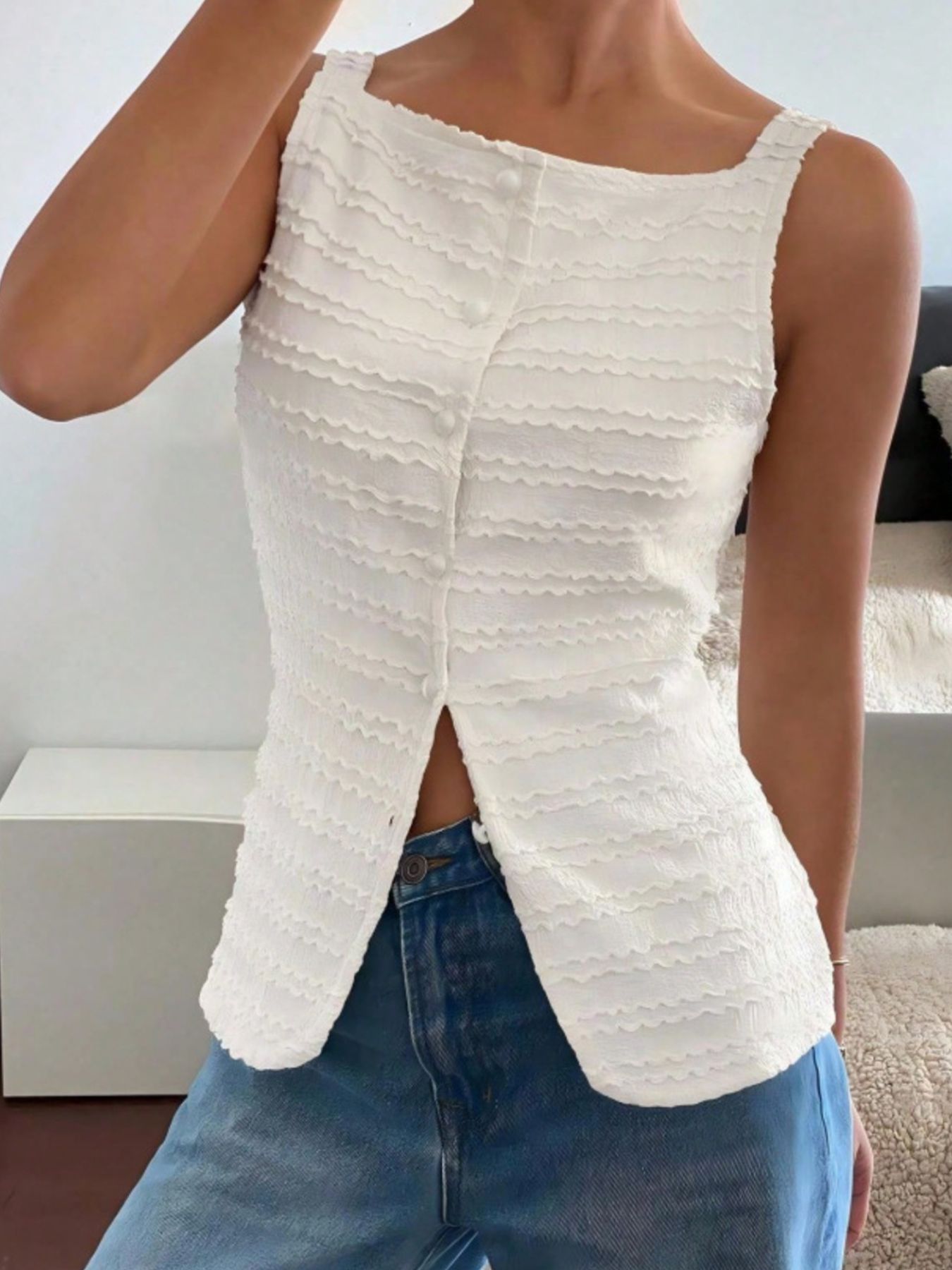 White wavy textured button-front tank top with a square neckline and split hem.