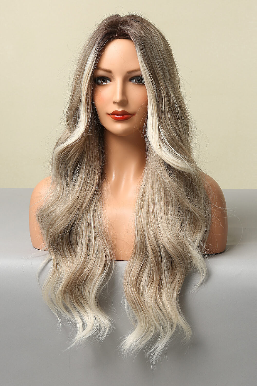 Ombre beach wave wig in light brown/blonde balayage with face-framing layers.