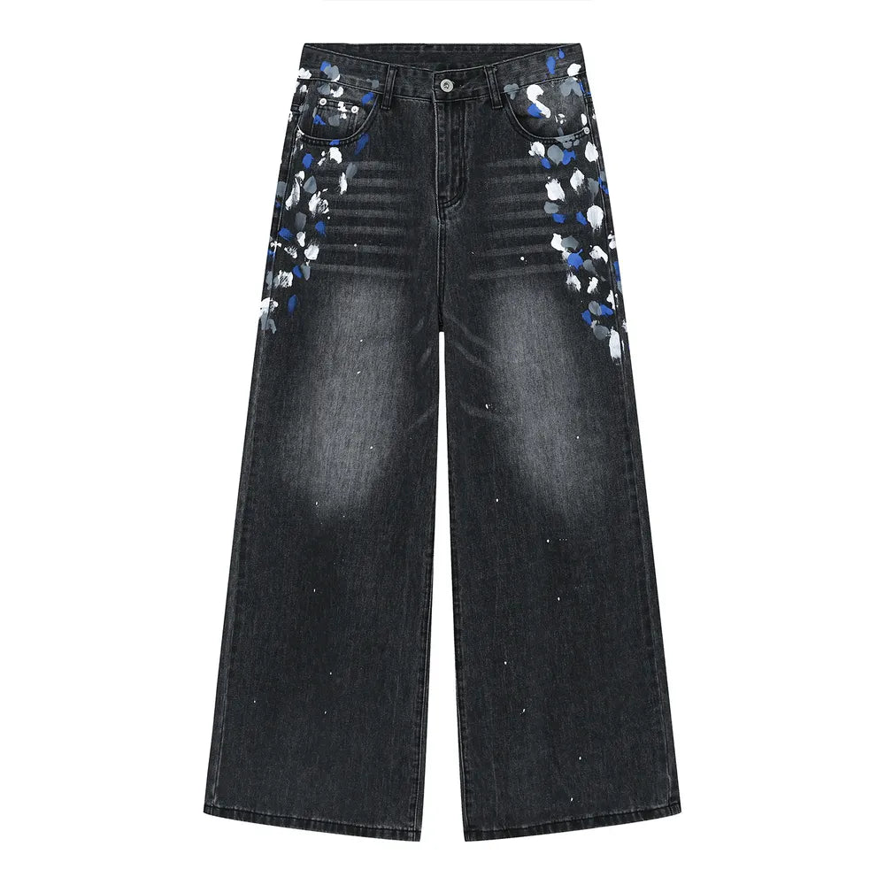 Dark wash wide leg jeans with painterly brushstroke details on pockets and legs.