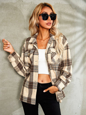 Checkered collared jacket in tan and brown plaid with button front and chest pockets.