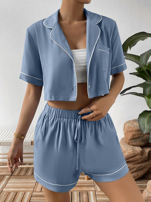 Light Blue contrast trimmed cropped pajama set with buttoned shirt and drawstring shorts.