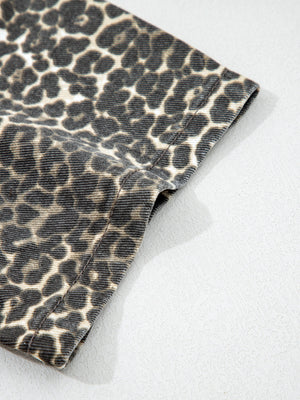 Denim shirt with leopard print, short sleeves, and a classic collar.